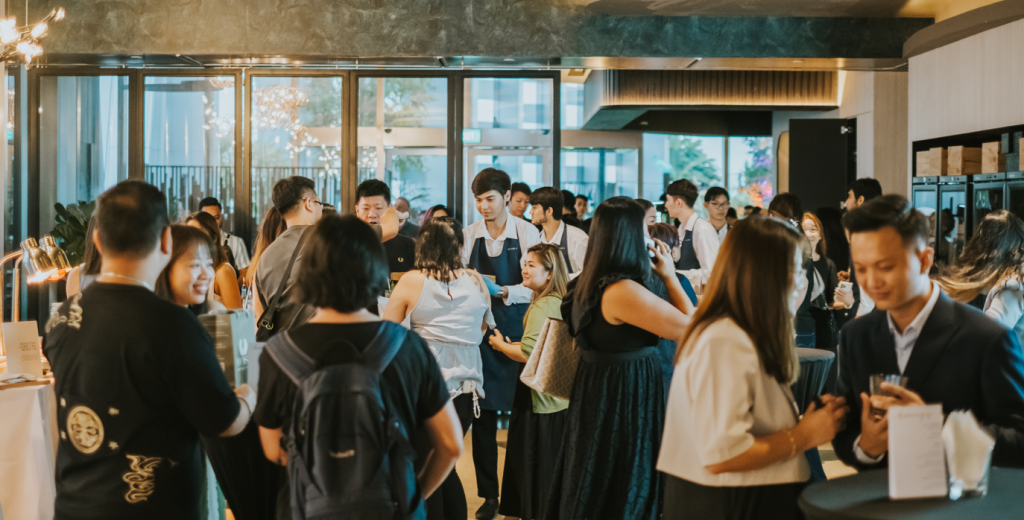 Guests mingling at a standing corporate event at 1-Arden