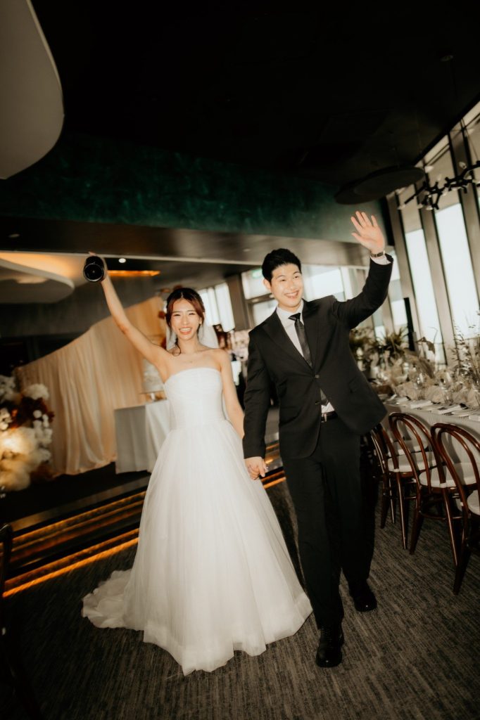 Bride and groom celebrating their grand entrance at a 1-Arden wedding reception