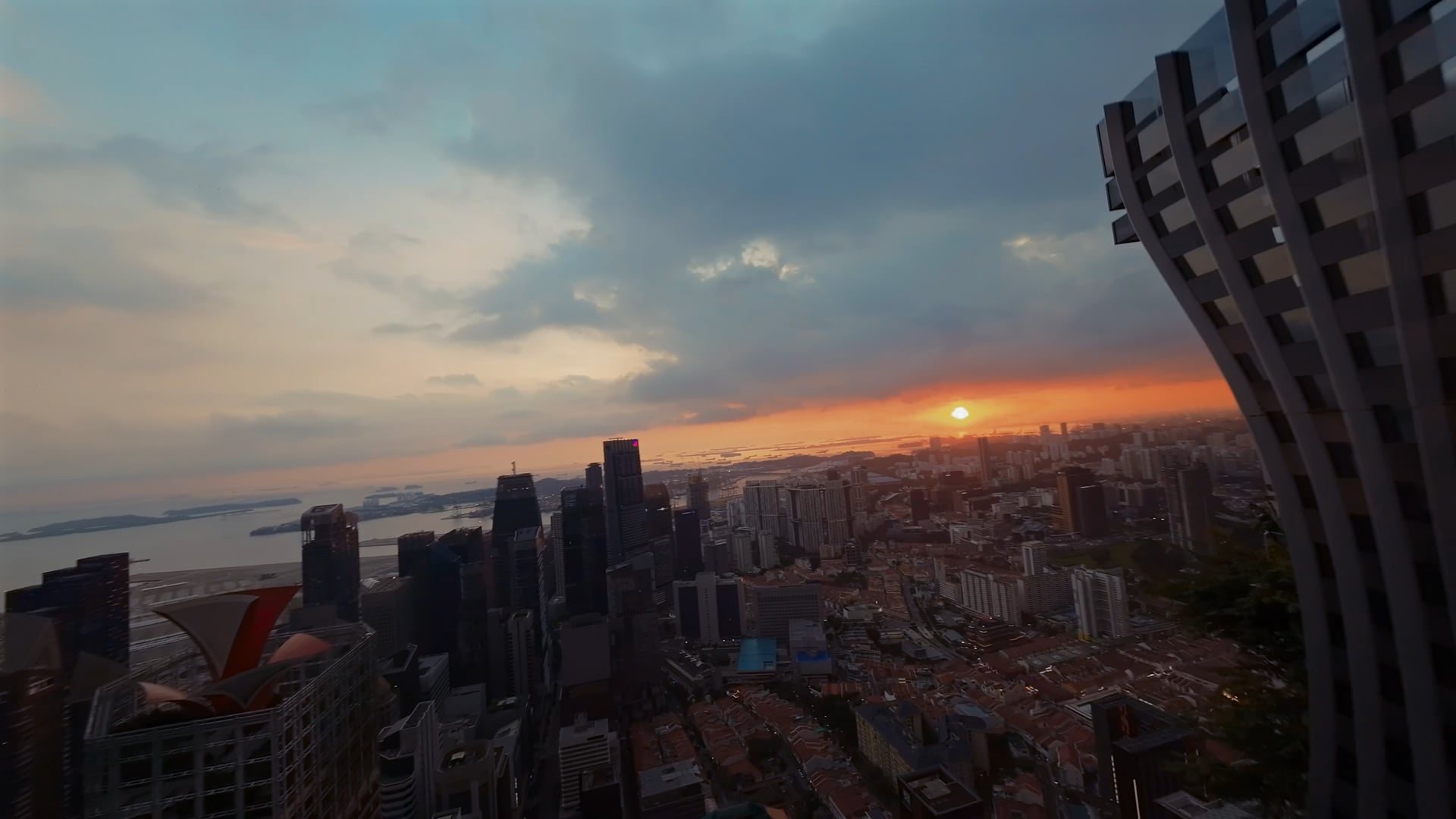 Sunset over the Singapore skyline from the 1-Arden rooftop wedding venue at CapitaSpring, fly-through video